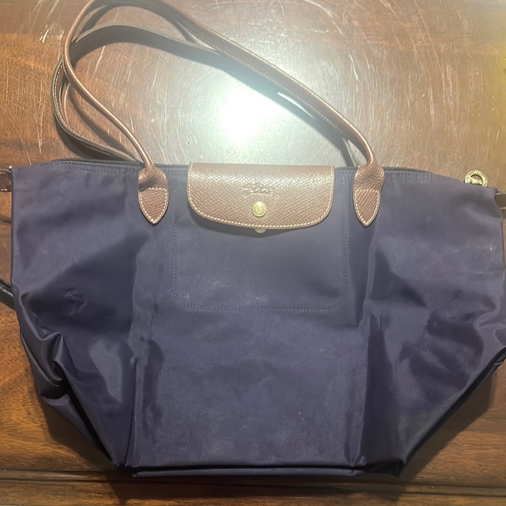 Dimensions 12.2 in (L measured-base of the bag) x 11.8 in (H) x 7.5 in (W)